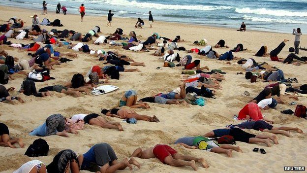 The protesters took to Sydney's Bondi Beach to make a statement about the global climate change debate