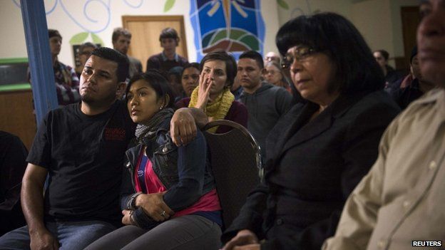 Undocumented immigrants and supporters watch Obama speak on immigration in Philadelphia