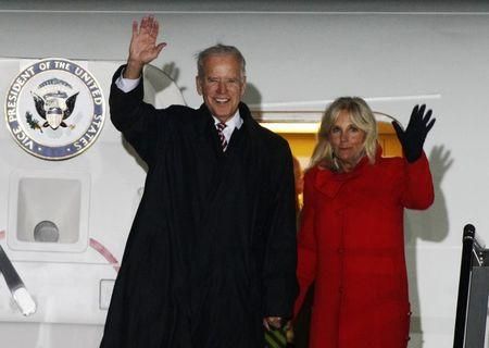 U.S. Vice President Joe Biden (L) and his wife Jill wave upon their arrival at Boryspil International …