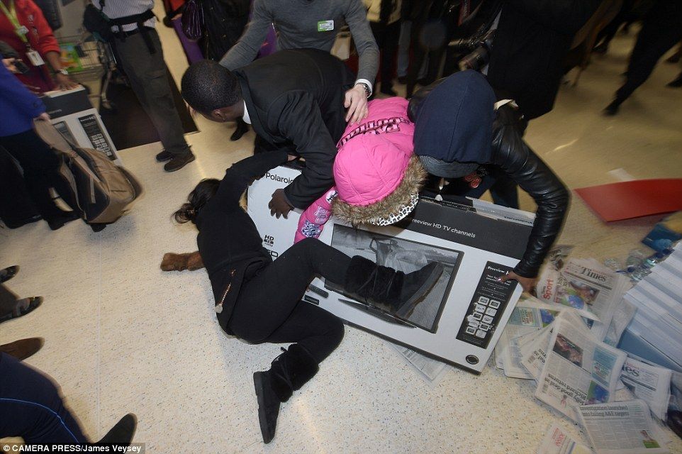 The shoppers were seen pushing and fighting one another on the shop floor as they tried to get their hands on the reduced item