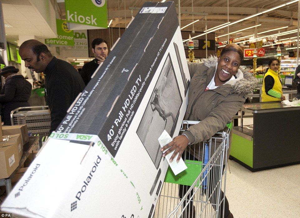 Cherrelle Welch in north London with her 40in HD Polaroid television being sold by the supermarket for just £139 - £90 less than usual  Read more: http://www.dailymail.co.uk/news/article-2852585/Mayhem-Black-Friday-begins-Shoppers-clash-supermarkets-trying-grab-bargains-Boots-Game-Curry-s-PC-world-websites-crash-thousands-start-hunt-Christmas-deals.html#ixzz3KMhCGJWb  Follow us: @MailOnline on Twitter | DailyMail on Facebook