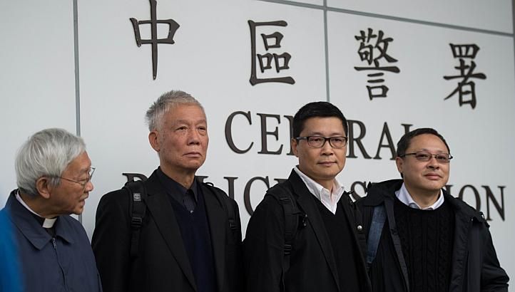 Benny Tai (right), an original founder of the pro-democracy Occupy movement,  with (from left) Chinese Cardinal of the Catholic Church and former bishop of Hong Kong, Joseph Zen, and Occupy Central co-leaders Chu Yiu-ming and Chan Kin-man surrender to police in Hong Kong on Dec 3, 2014.(Photo:AFP)