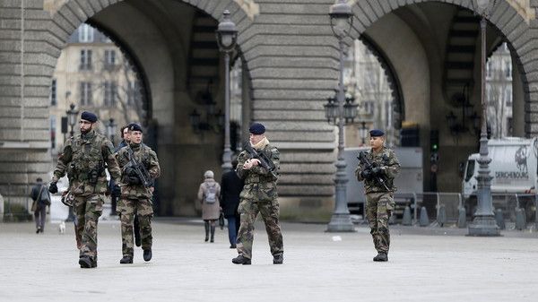French soldiers patrol near the Louvre Museum in Paris as part of the highest level of “Vigipirate” security plan January 8. (Reuters)