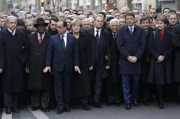 French President Francois Hollande is surrounded by head of states. 