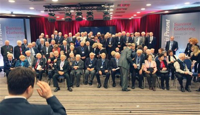 Holocaust survivors prepare for a group photo in Krakow, Poland, Monday, Jan. 26, 2015, a day before commemorations at the former Nazi death camp Auschwitz-Birkenau marking the 70th anniversary of the camp's liberation.