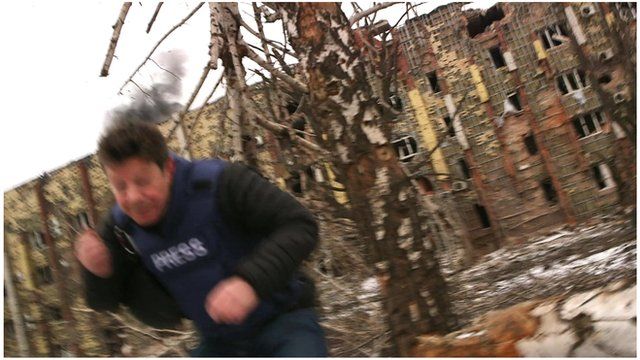 The BBC's Ian Pannell flees artillery fire at the ruins of Donetsk airport