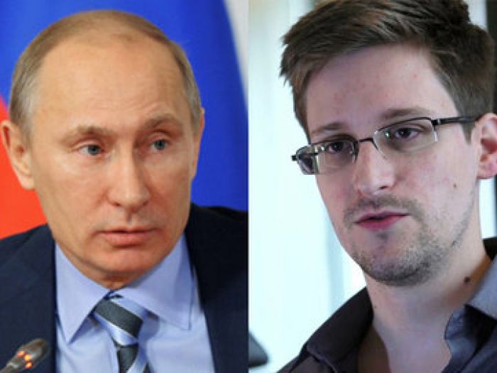 Putin: Snowden still in Moscow airport, won't be extradited, free to go anywhere