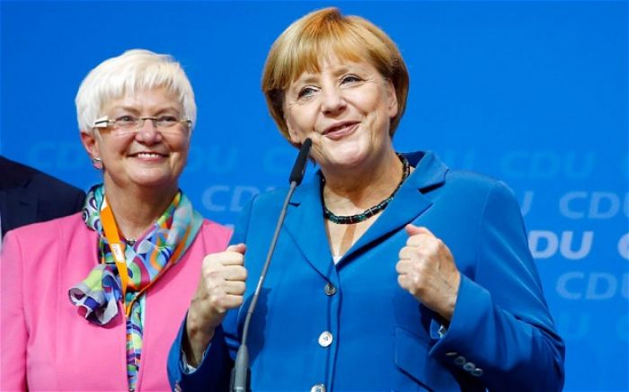 Triumphant Angela Merkel begins search for new coalition ally after historic German election win
