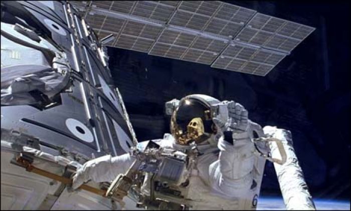 Two U.S. astronauts set to make Christmas Eve spacewalk for repair job