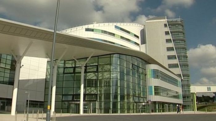 Queen Elizabeth Hospital surgeon suspended over 'branding' claim