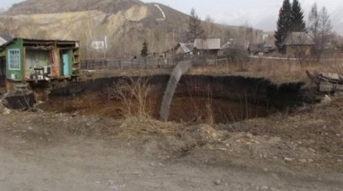 House collapses into crater in Kazakh mining town