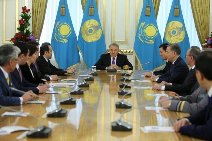 Political figures take oath at a ceremony presided by Kazakh leader