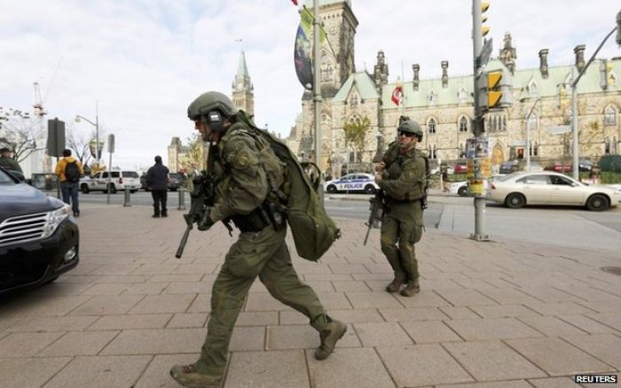 Ottawa shootings: Soldier killed and city on lockdown