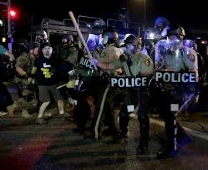National Guard, police curb Ferguson unrest as protests swell across U.S.