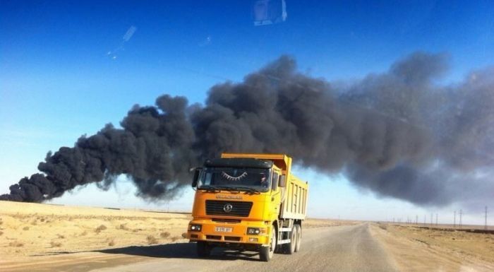 Oil wastes burn in an industrial zone in Aktau