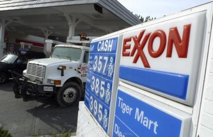 Exxon fourth-quarter profit tops estimate, share buyback slashed in half