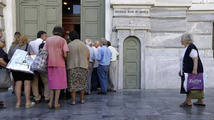 Greek debt crisis: Banks reopen amid tax rise