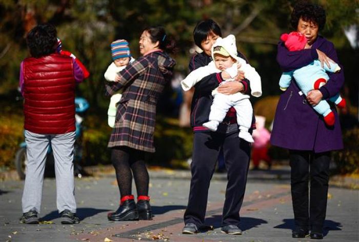 China to allow all couples two children to counter aging population