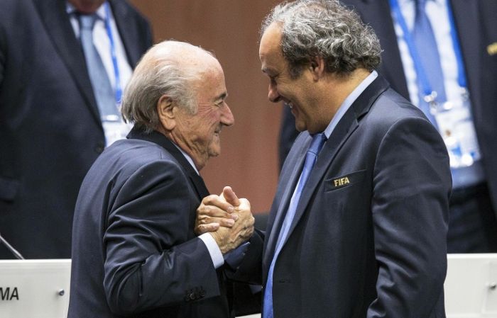 FIFA bans Blatter, Platini from all international football activities for eight years