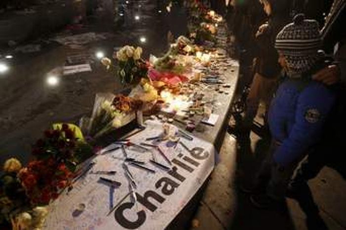 Parisians gather to remember victims of Charlie Hebdo attacks