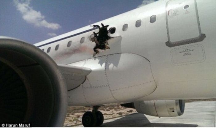 Airport workers seen with laptop used in Somalia in-flight jet blast