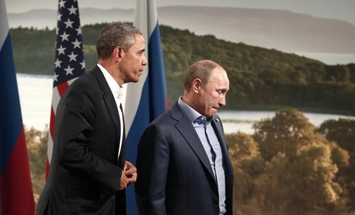 Опрос: Путин уступил Обаме в популярности